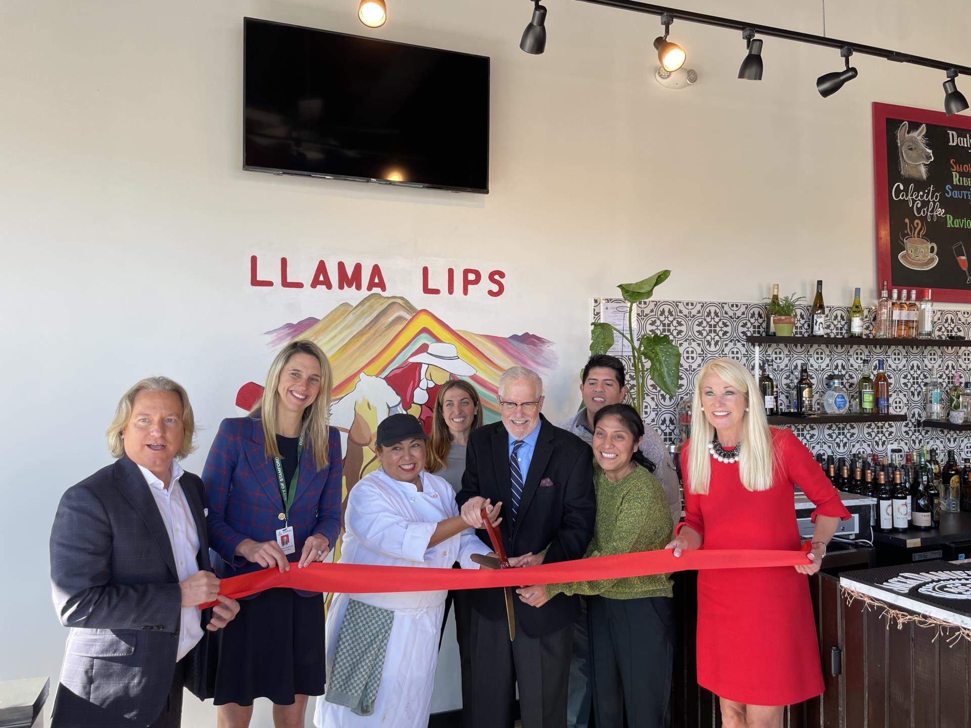 Mayor Simmons smiles for a photo with the owner of Llama Lips for their grand opening